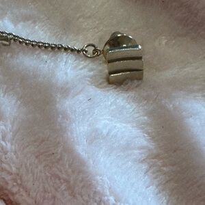 Gold tone lapel pin by sarah coventry